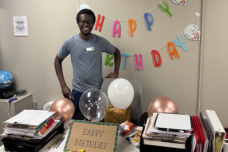 Student's decorated Davis's desk for his birthday David at his desk with birthday decorations