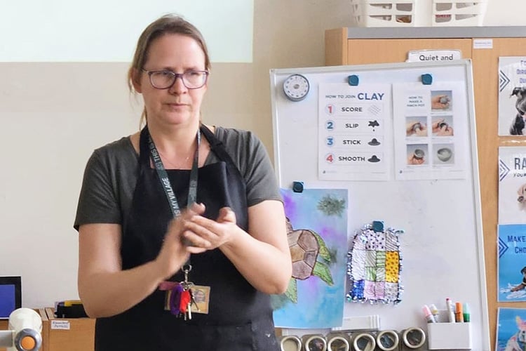 Kelly demonstrates working with clay